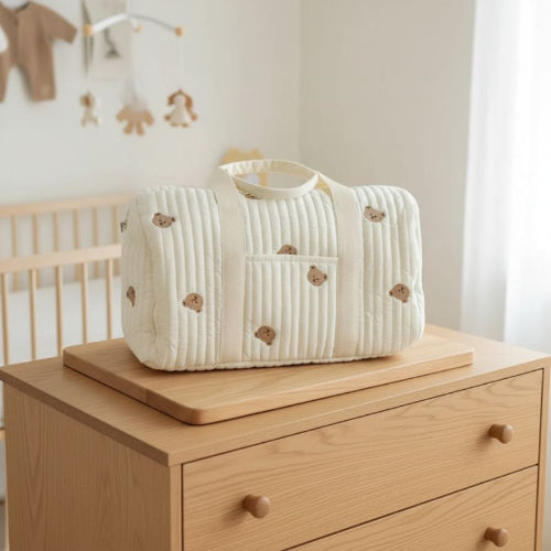 sac langer ours sur planche en bois
