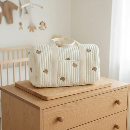 sac langer ours sur planche en bois
